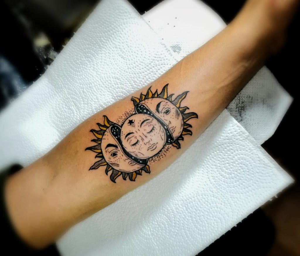 Masked Sun and Moon Tattoo for the Depiction of Phases of Life Tattoo on skin