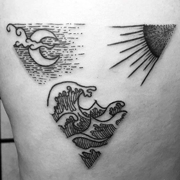Wavy Sun and Moon Tattoo With a Triangular Flare Tattoo on skin