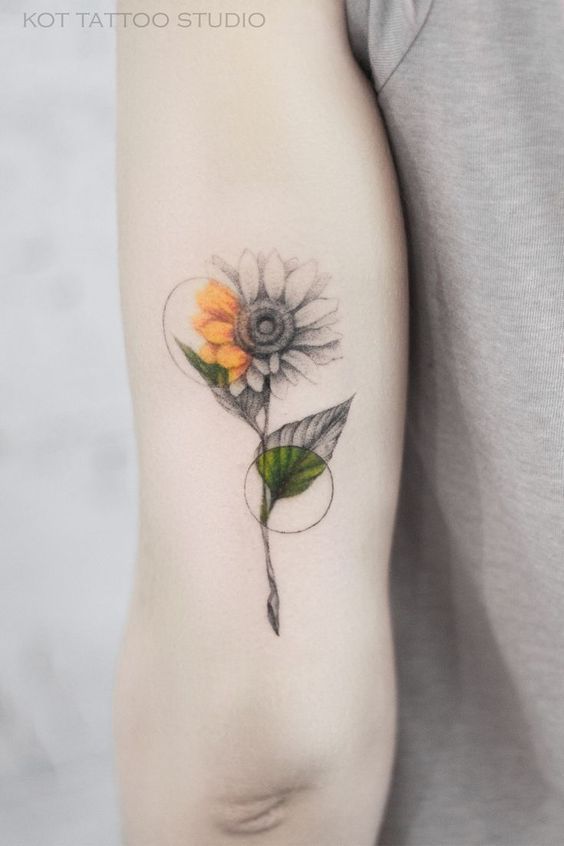 Black and Grey Sunflower Tattoo with Circles of Color Tattoo on skin