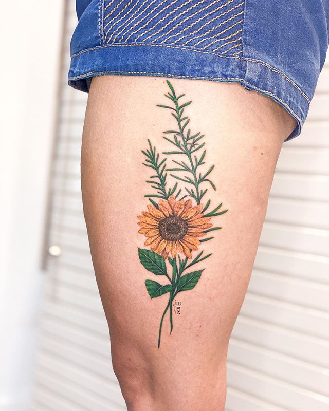 Fresh Sunflower Tattoo with Foliage Background Tattoo on skin
