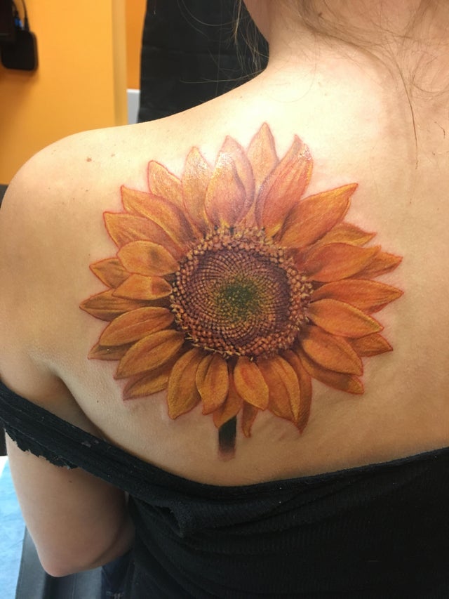 Natural Sunflower Tattoo with Incredible Detail Tattoo on skin