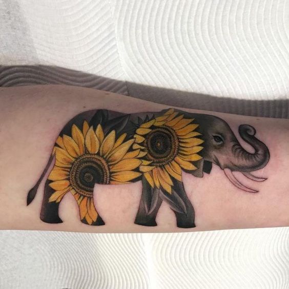 Ornate Sunflowers Painted on Elephant Tattoo Tattoo on skin