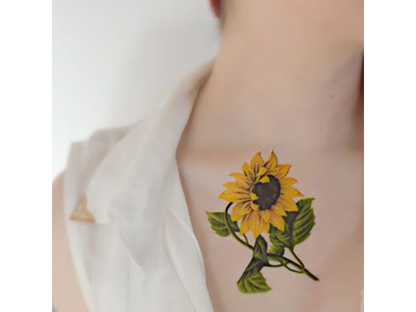 Realistically Colored and Textured Single Sunflower Tattoo Ideas Tattoo on skin