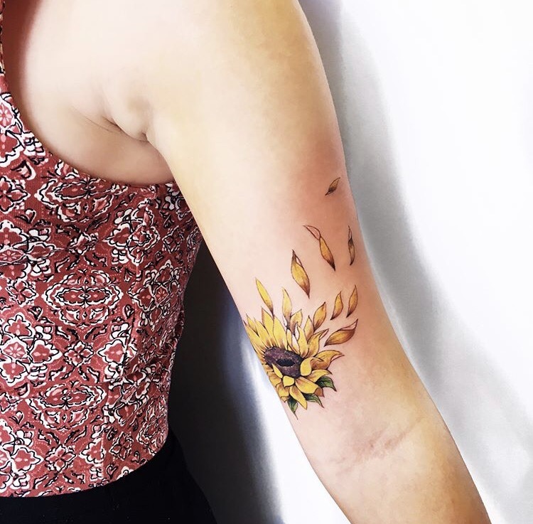 Sunflower Petals Floating in the Wind Tattoo Tattoo on skin