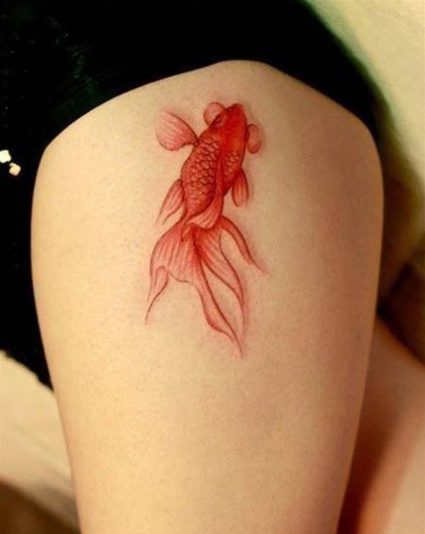 A beautiful fish tattoo on the thighs Tattoo on skin