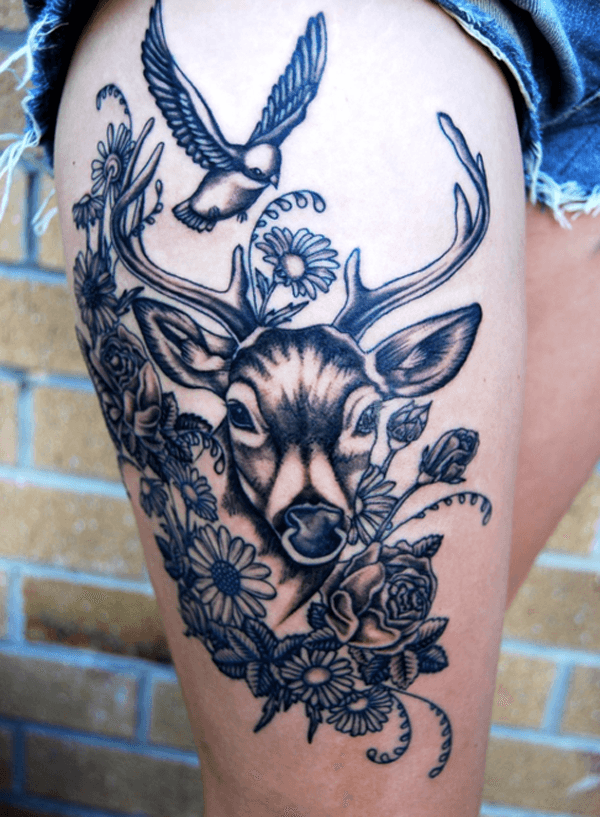A combination of gazelle, birds, and flowers thigh tattoo Tattoo on skin