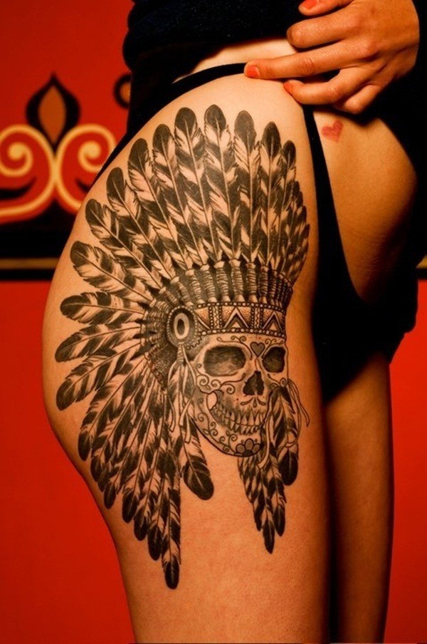 A large decorated skull tattoo on the thighs thigh tattoos