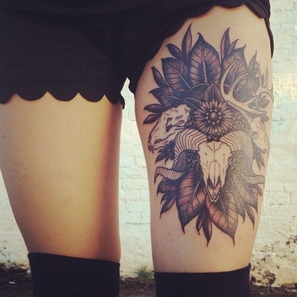 A sunflower tattoos with some creature appearing from it thigh tattoo Tattoo on skin