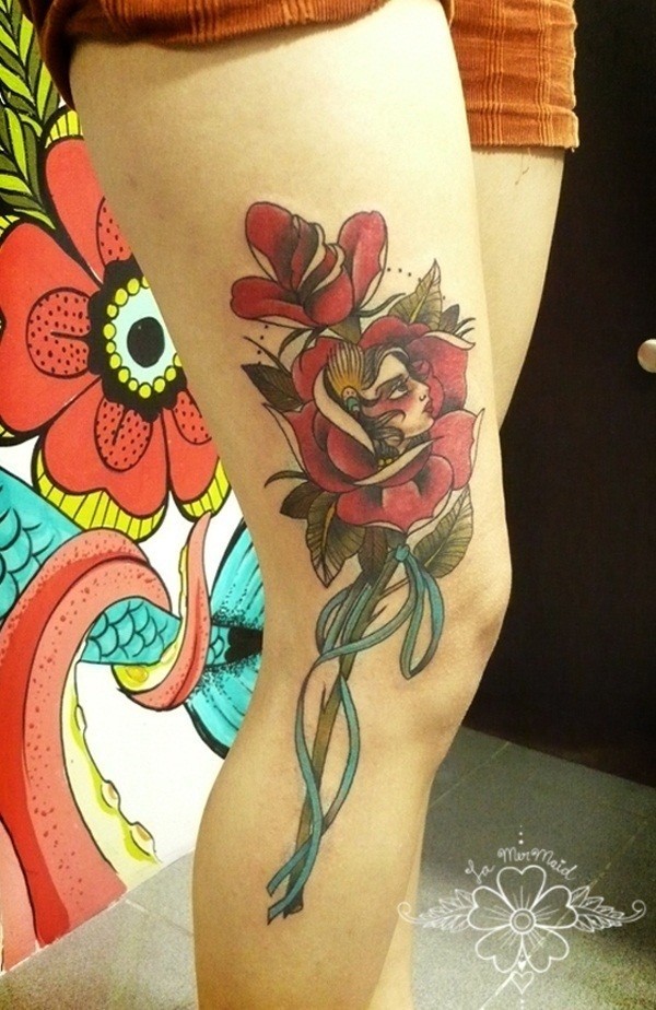 A young beautiful flowing flower thigh tattoo Tattoo on skin