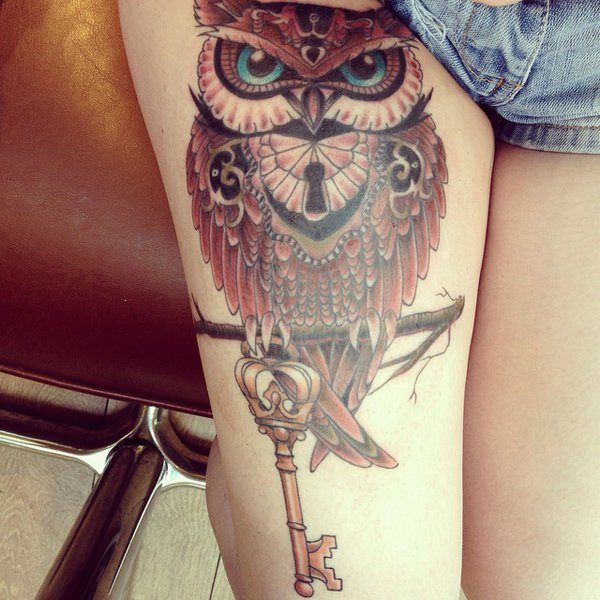 Owl’s tattoo on the thighs Tattoo on skin