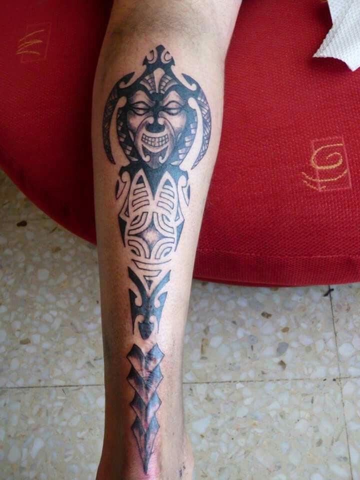 Stylized Tiki with Spearhead Motif Tiki Tattoo Tattoo on skin