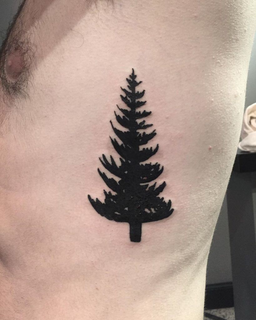 Bold Black Guardian Tree Rib Tattoo Tattoo on skin