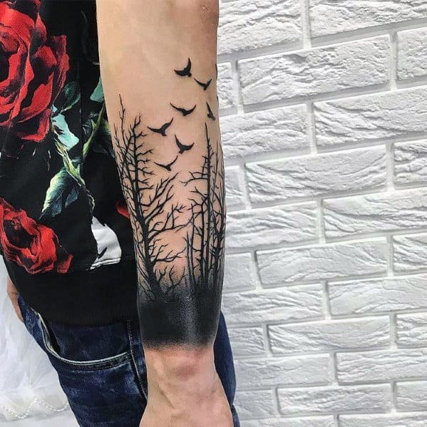 Crows Rise from Dark Woods Tattoo on skin