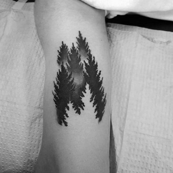 Optical Illusion Forest with Negative Space Tree Tattoo Tattoo on skin