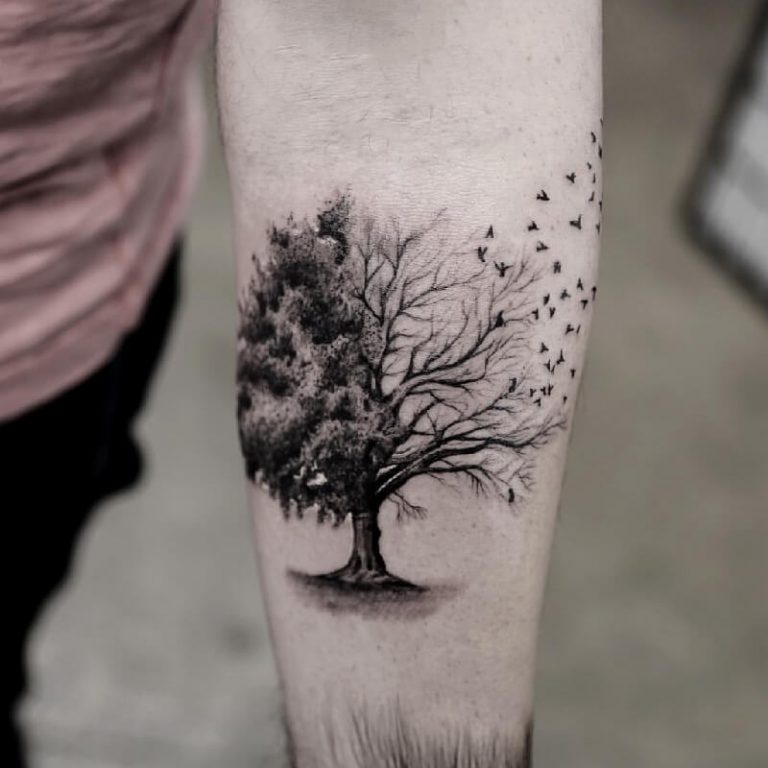 Surreal Tree into Flock of Birds Tree Tattoo Designs Tattoo on skin