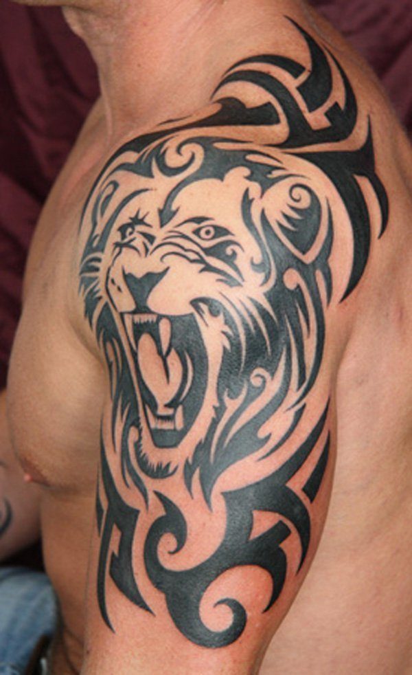 A Tribal inspired Lion Tattoo on a shoulder Tattoo on skin