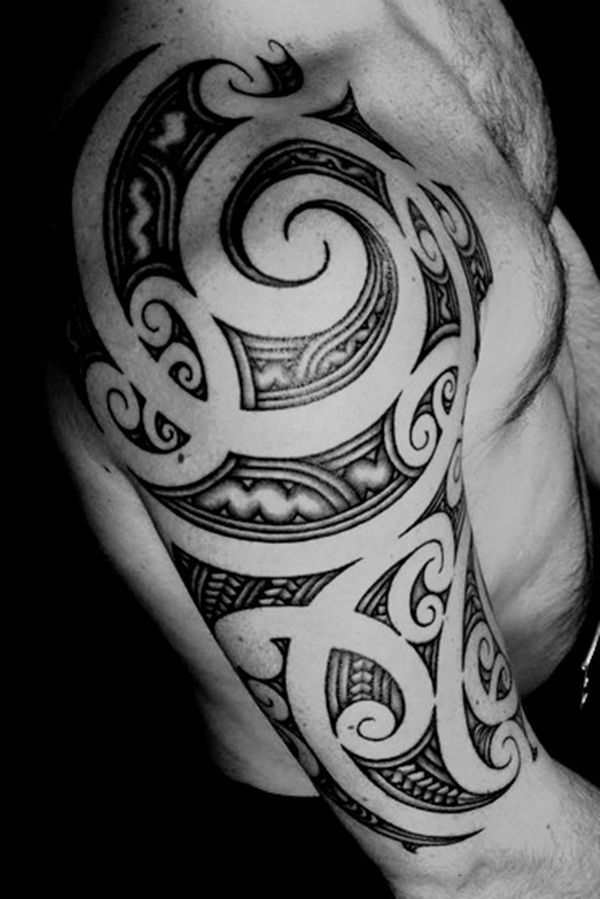 Awesome Maori Shoulder and Half Sleeve Tattoo on Man’s Arm Tattoo on skin