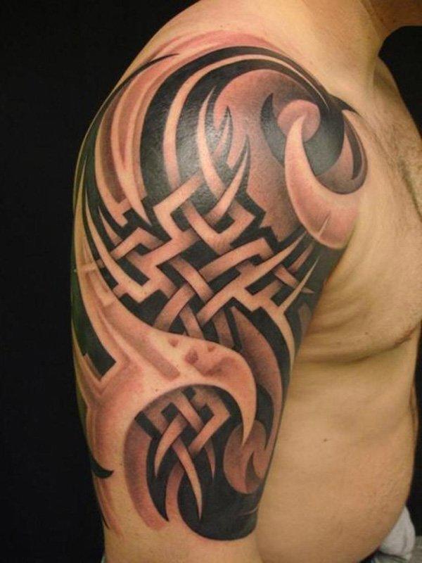 Two coloured Tribal Tattoo on a Hand Tattoo on skin