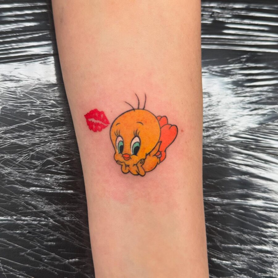 Adorable Tweety Tattoo with Lip Prints Tattoo on skin