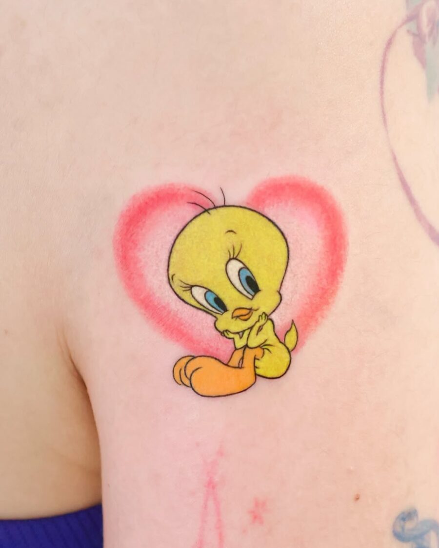 Charming Tweety Tattoo Within a Heart Tattoo on skin