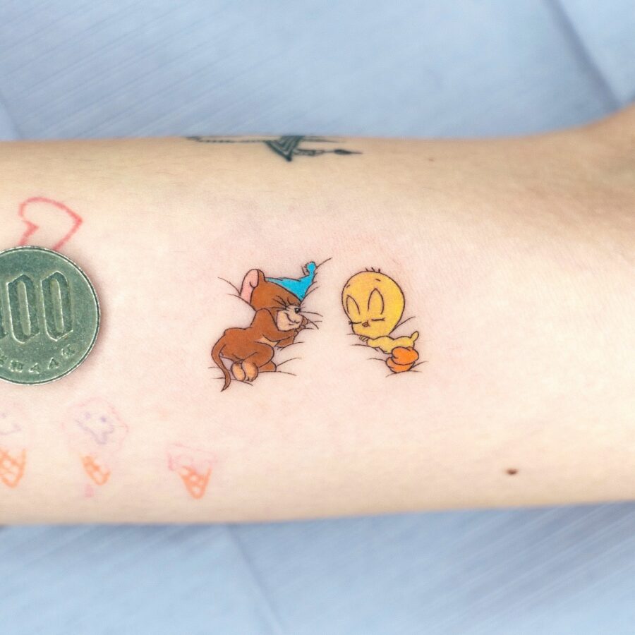 Playful Tweety and Mouse Tattoo Design Tattoo on skin