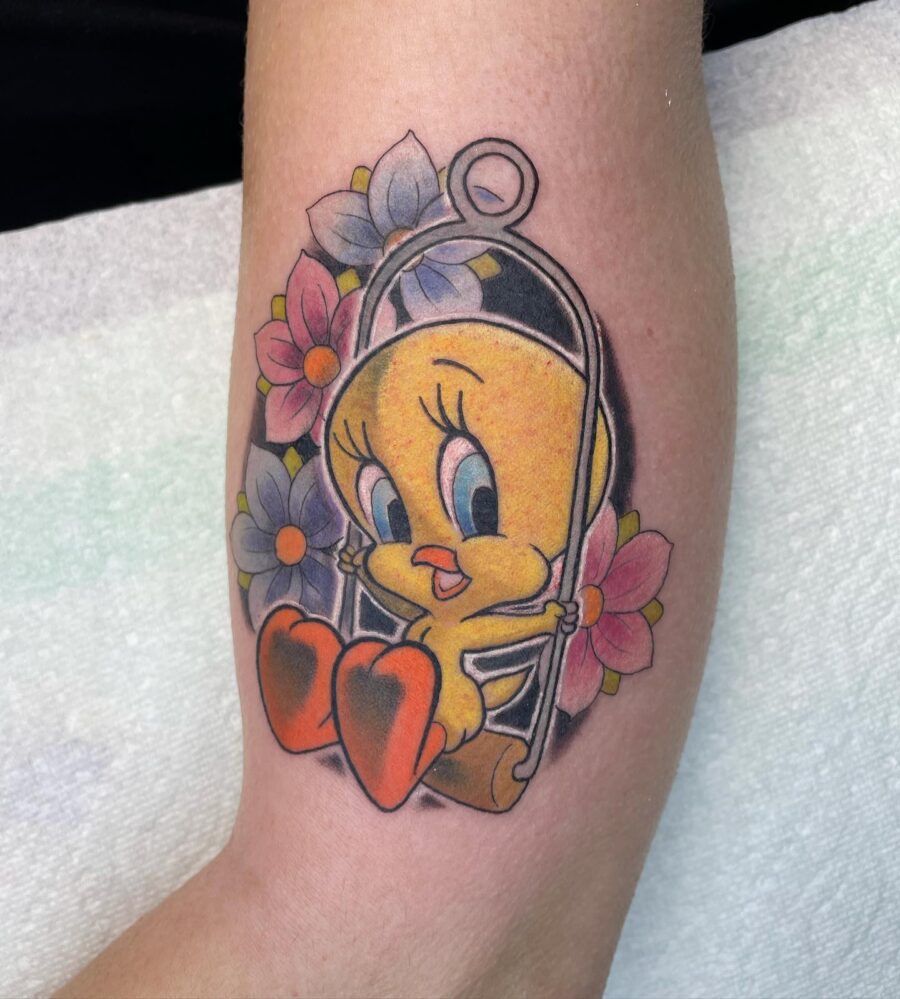 Playful Tweety Bird on a Swing Tattoo on skin