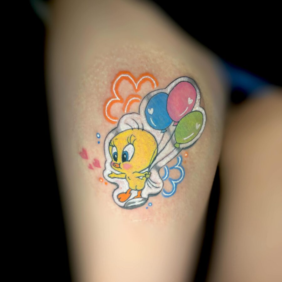 Playful Tweety Bird with Balloons Inked Design Tattoo on skin