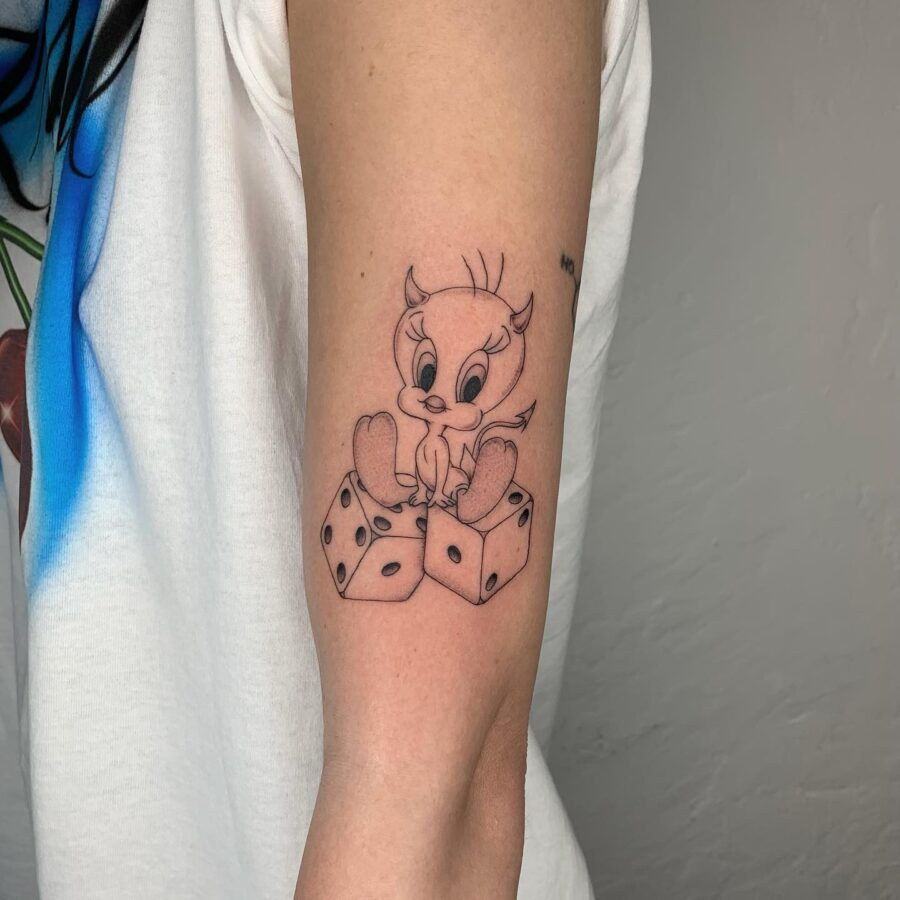 Playful Tweety Bird with Dice Tattoo Tattoo on skin