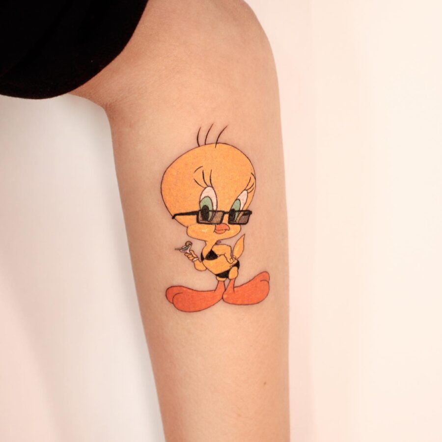 Sassy Tweety Tattoo with Stylish Sunglasses Tattoo on skin
