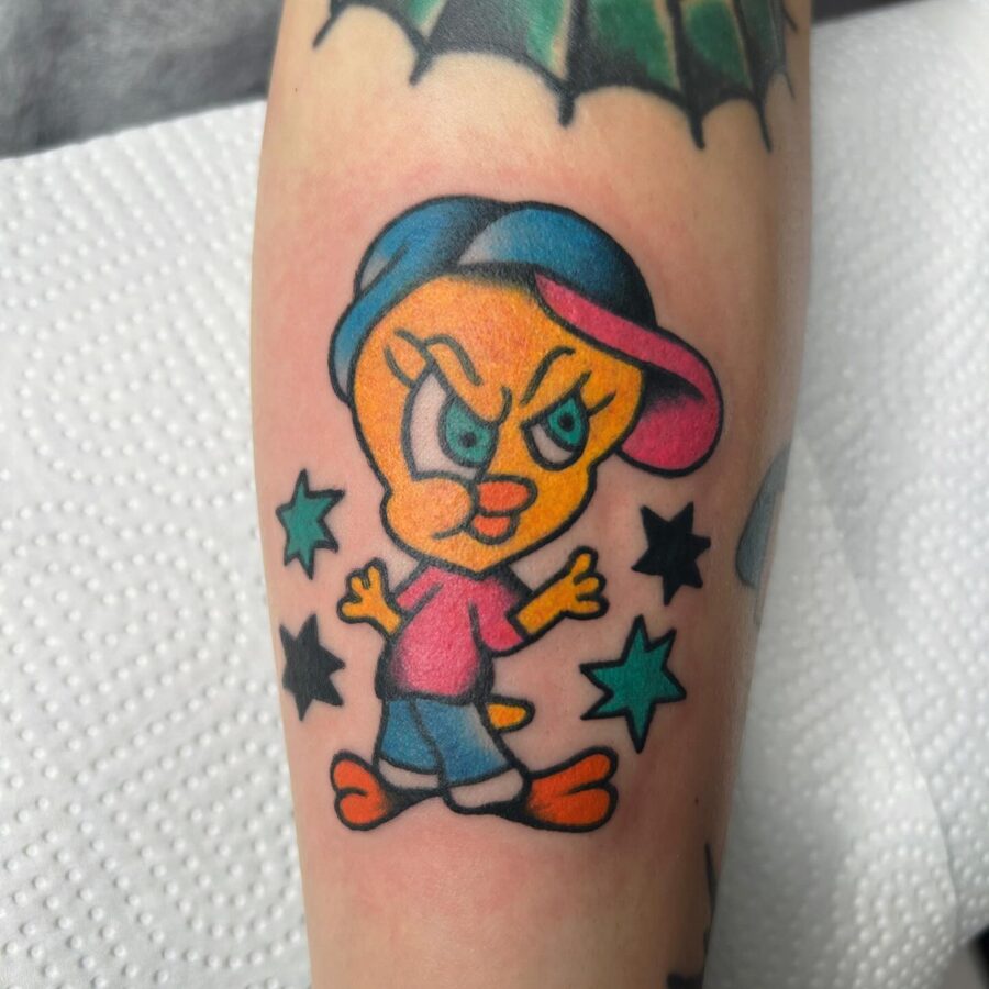 Vibrant Tweety Bird Tattoo with Attitude Tattoo on skin