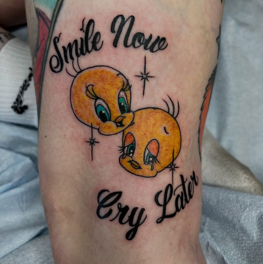 Whimsical Tweety Tattoo with a Clever Phrase Tattoo on skin