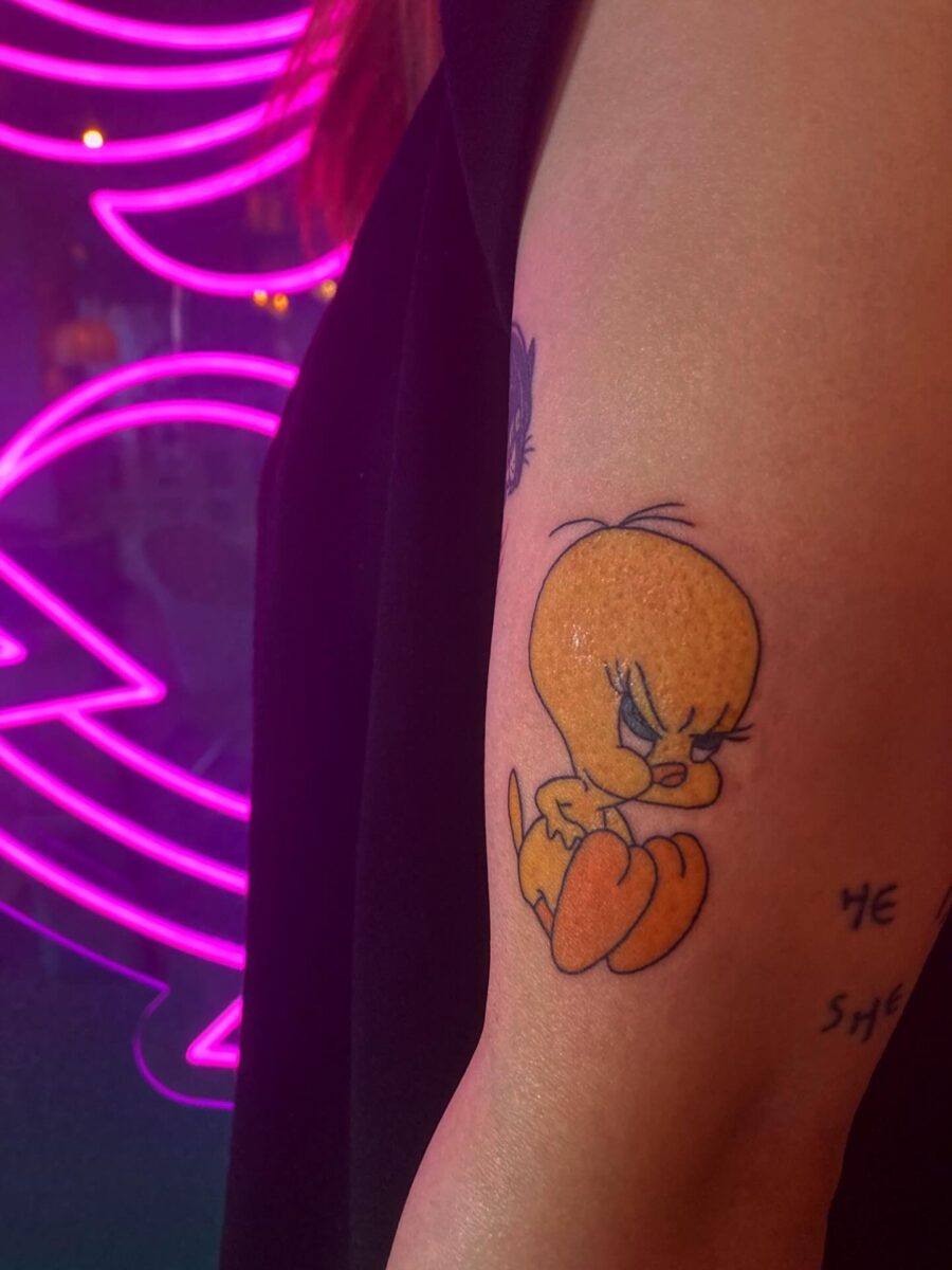 Whimsical Tweety Tattoo with Attitude Tattoo on skin