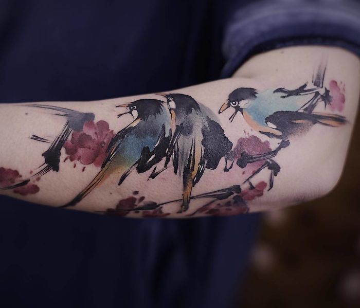 The Watercolor Birds on a Flowered Branch Tattoo Ideas Tattoo on skin