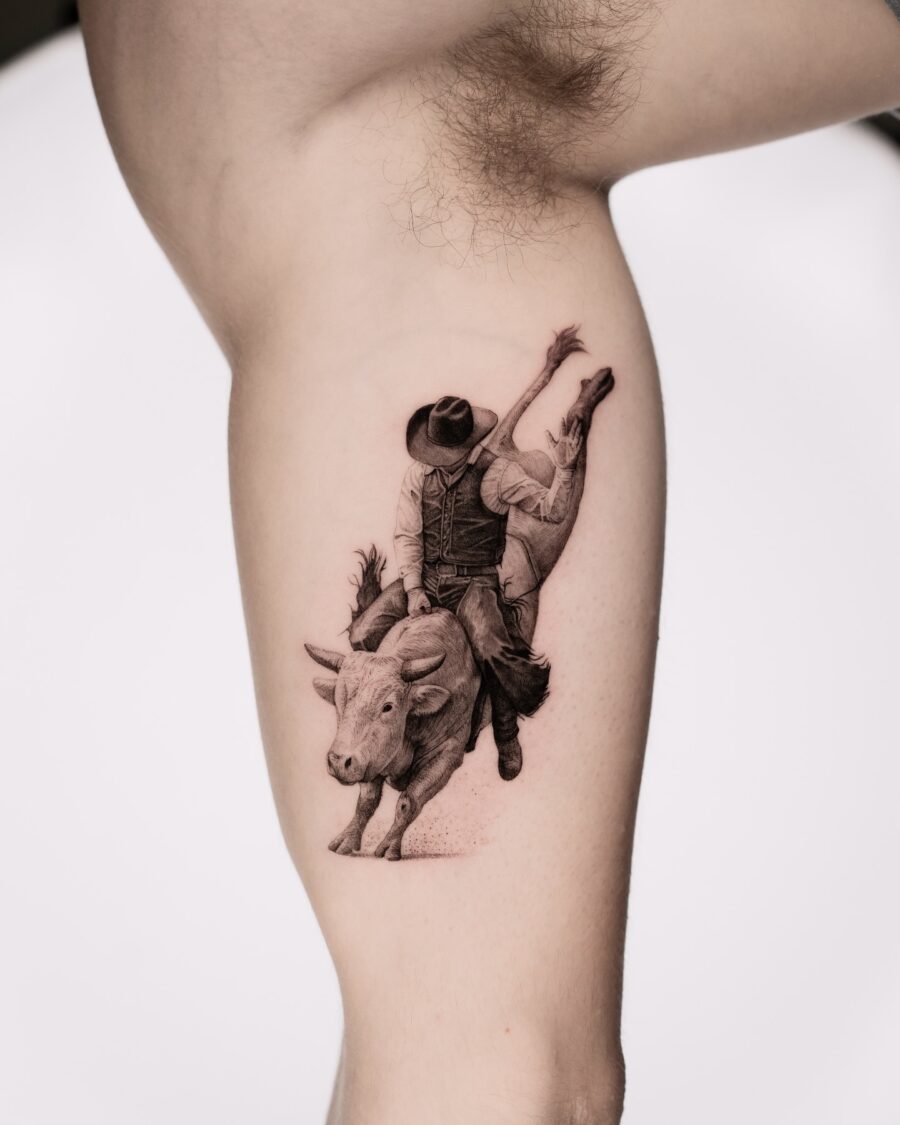 Dynamic bull rider tattoo on the thigh Tattoo on skin