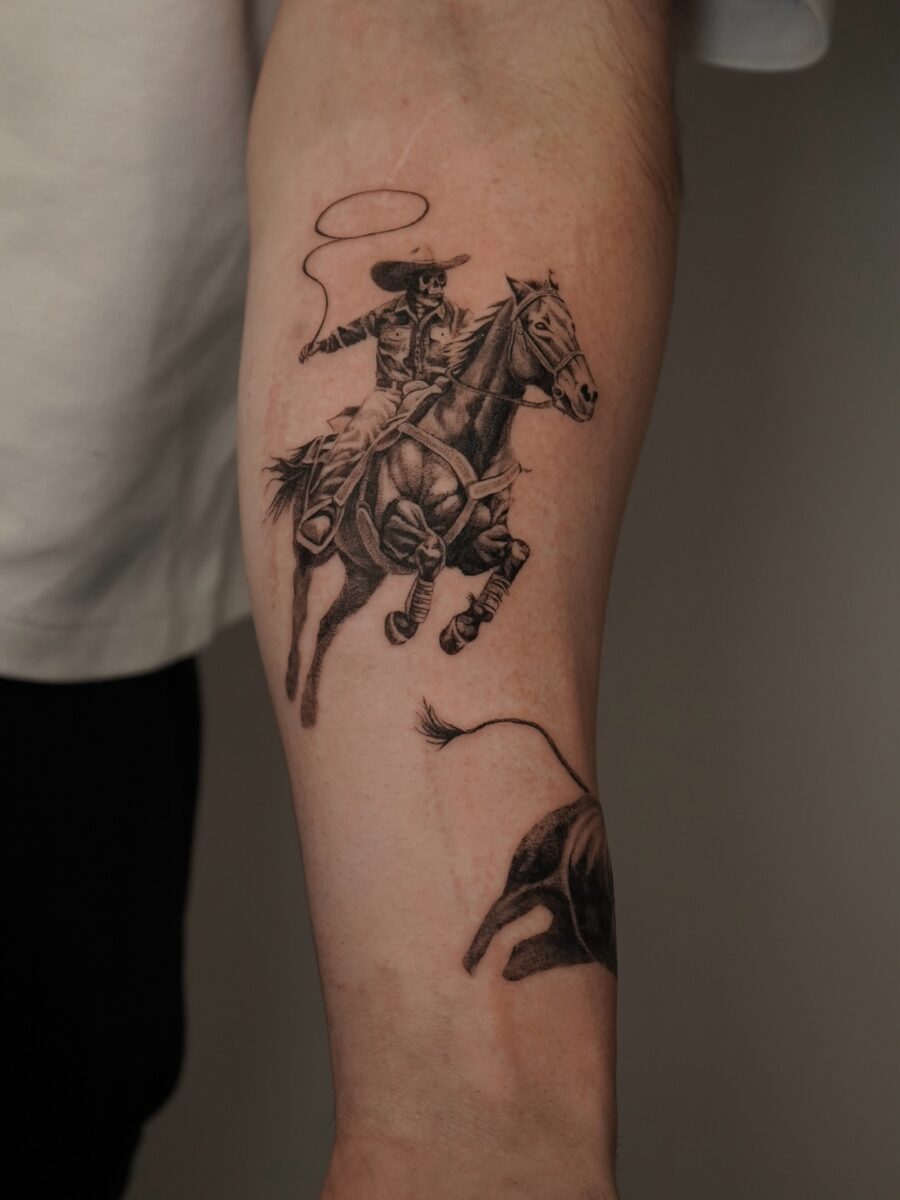 Dynamic cowboy tattoo showcasing western spirit Tattoo on skin