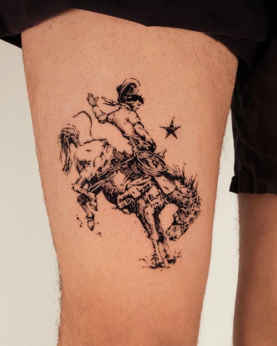 Dynamic western tattoo of a horse and rider Tattoo on skin