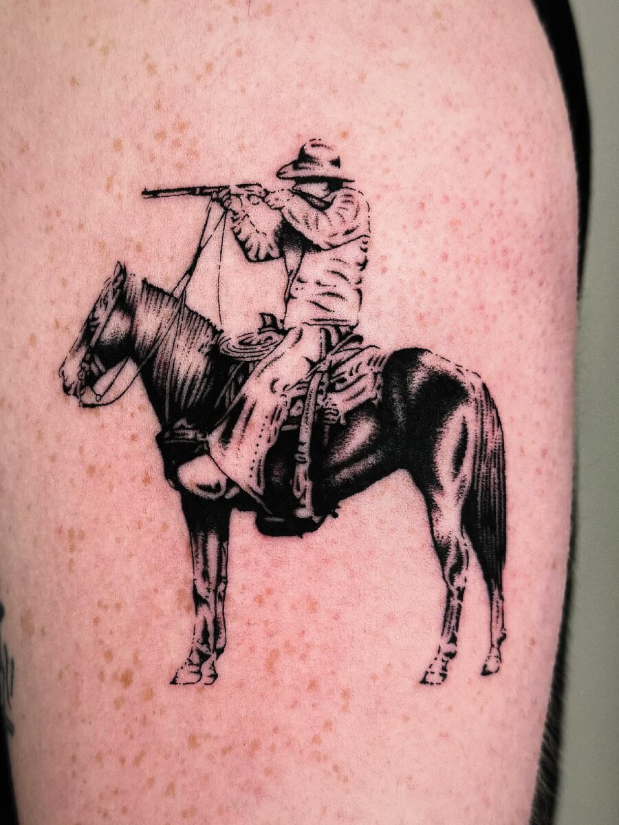 Intricate cowboy tattoo depicting western heritage. Tattoo on skin
