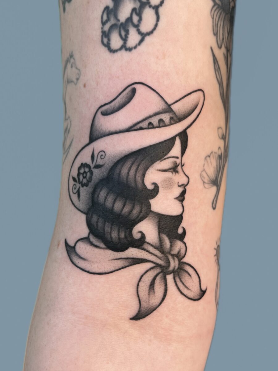Stylish Cowgirl Tattoo with Vintage Vibes Tattoo on skin