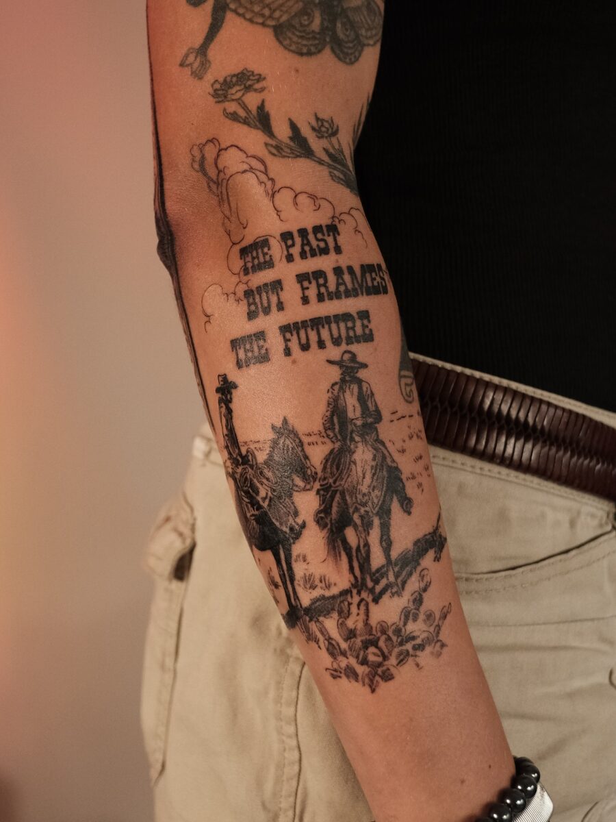 Symbolic Western Tattoo with Cowpoke Imagery Tattoo on skin