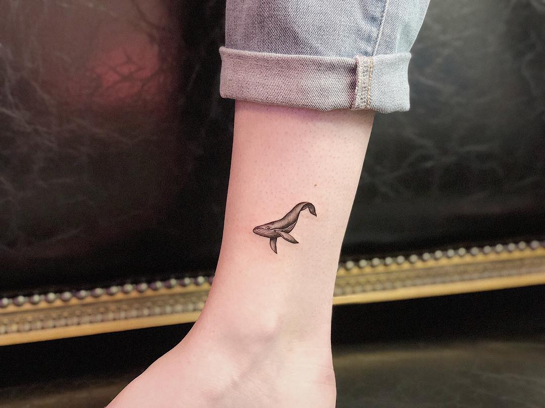 Charming Minimalist Whale Tattoo on the Ankle Tattoo on skin