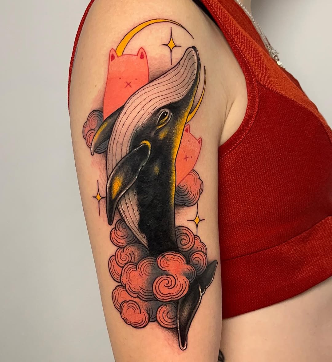 Colorful whale tattoo with whimsical elements Tattoo on skin