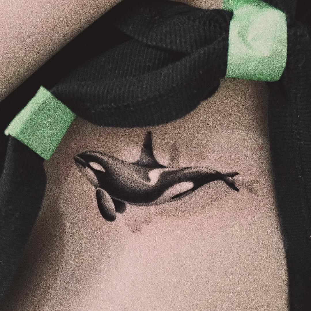 Delicate Orca Design with Fine Lines Tattoo on skin