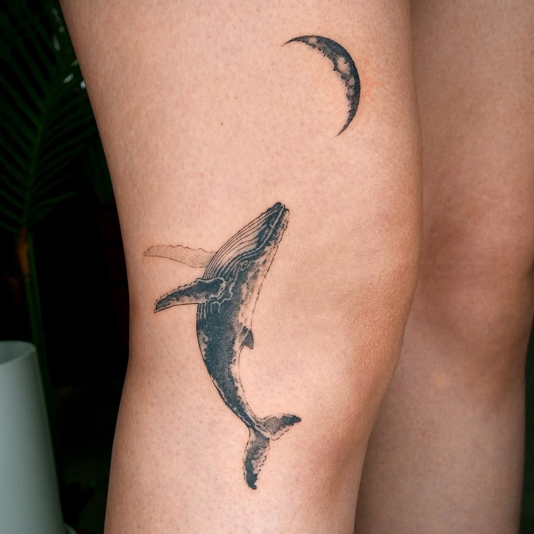 Elegant whale tattoo with a crescent moon Tattoo on skin