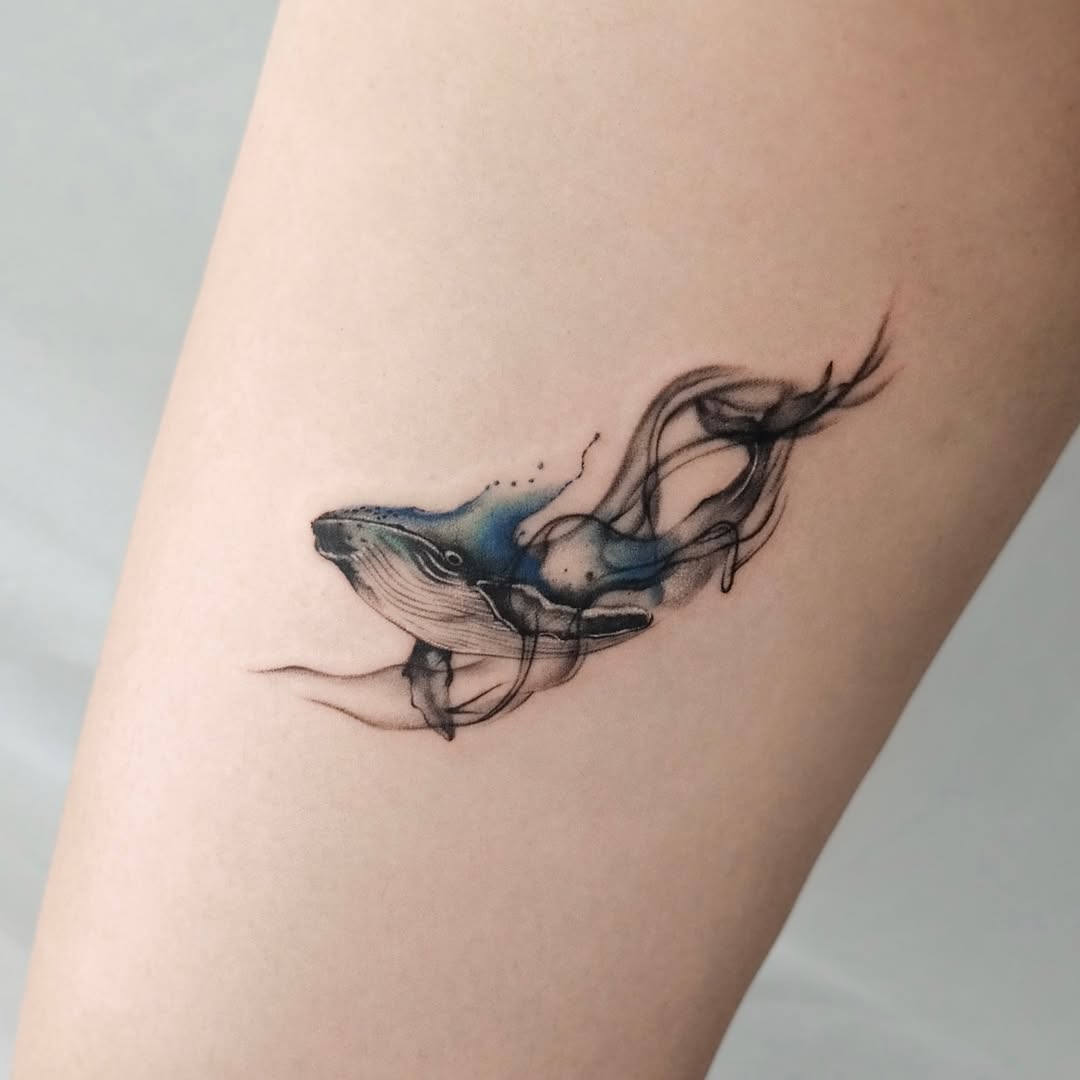 Elegant Whale Tattoo with Flowing Lines Tattoo on skin