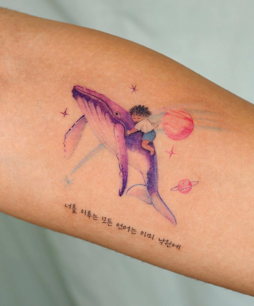Whimsical Whale Tattoo with Child and Planets whale tattoos