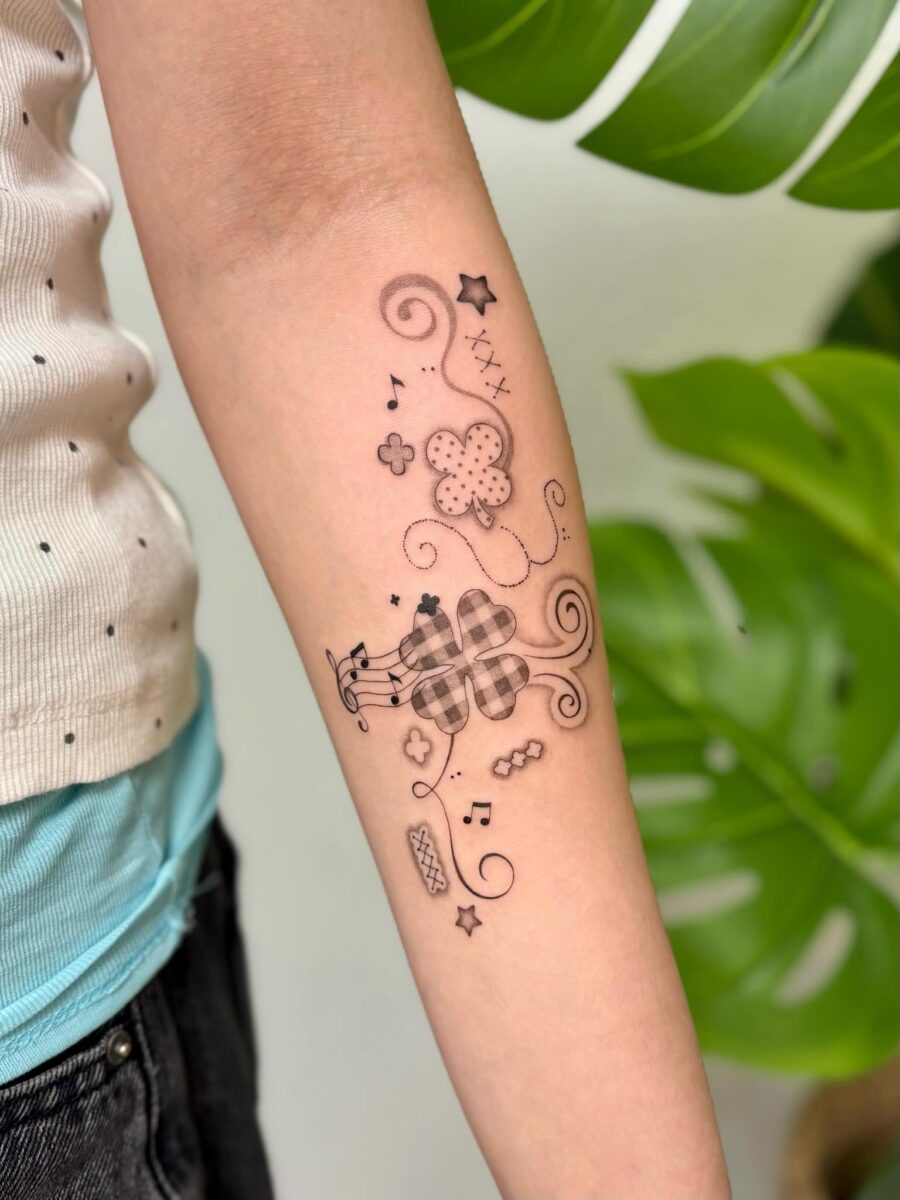 Charming and whimsical floral music tattoo Tattoo on skin