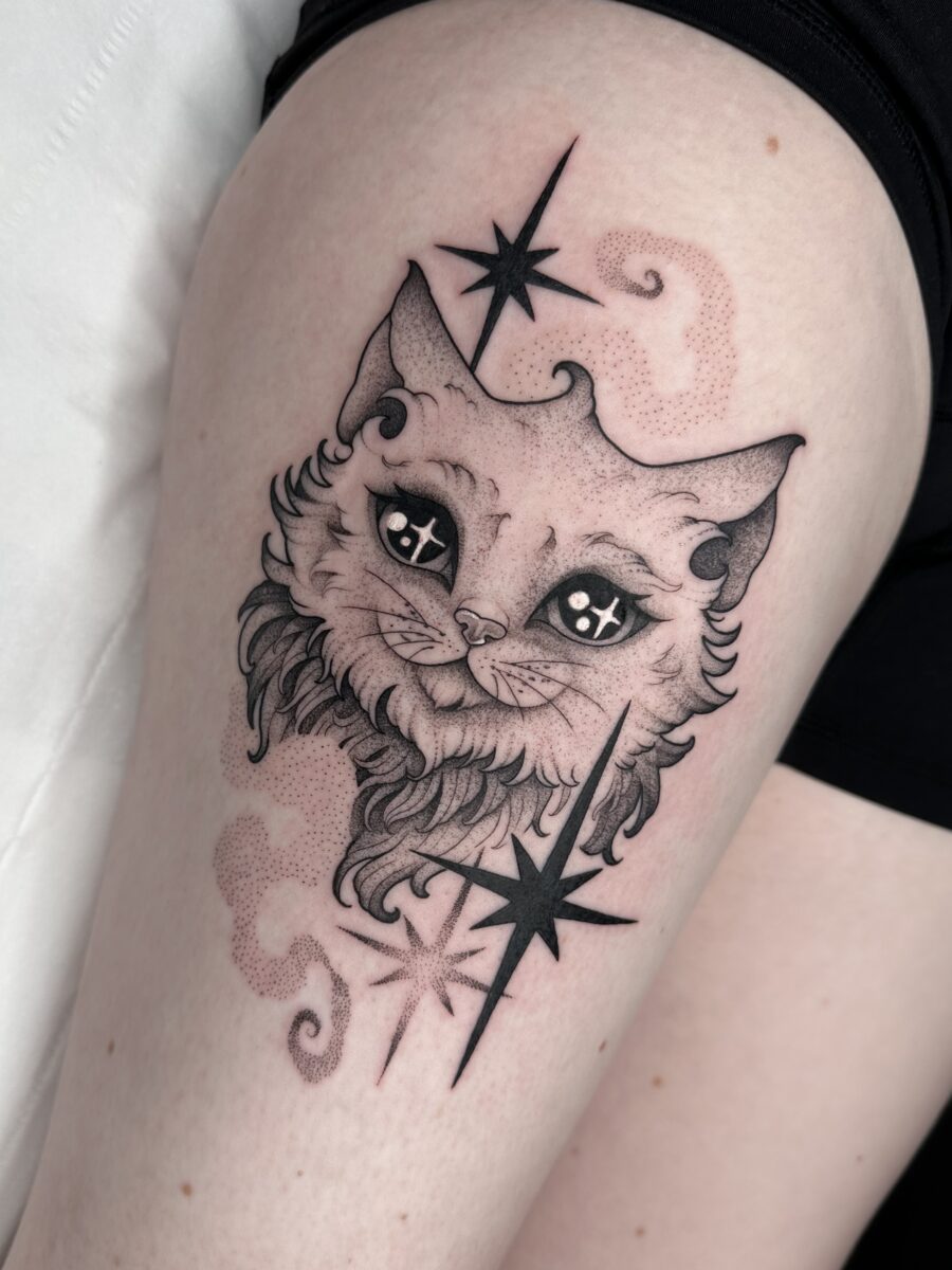 Charming Cat Tattoo Infused with Cosmic Vibes whimsical tattoos