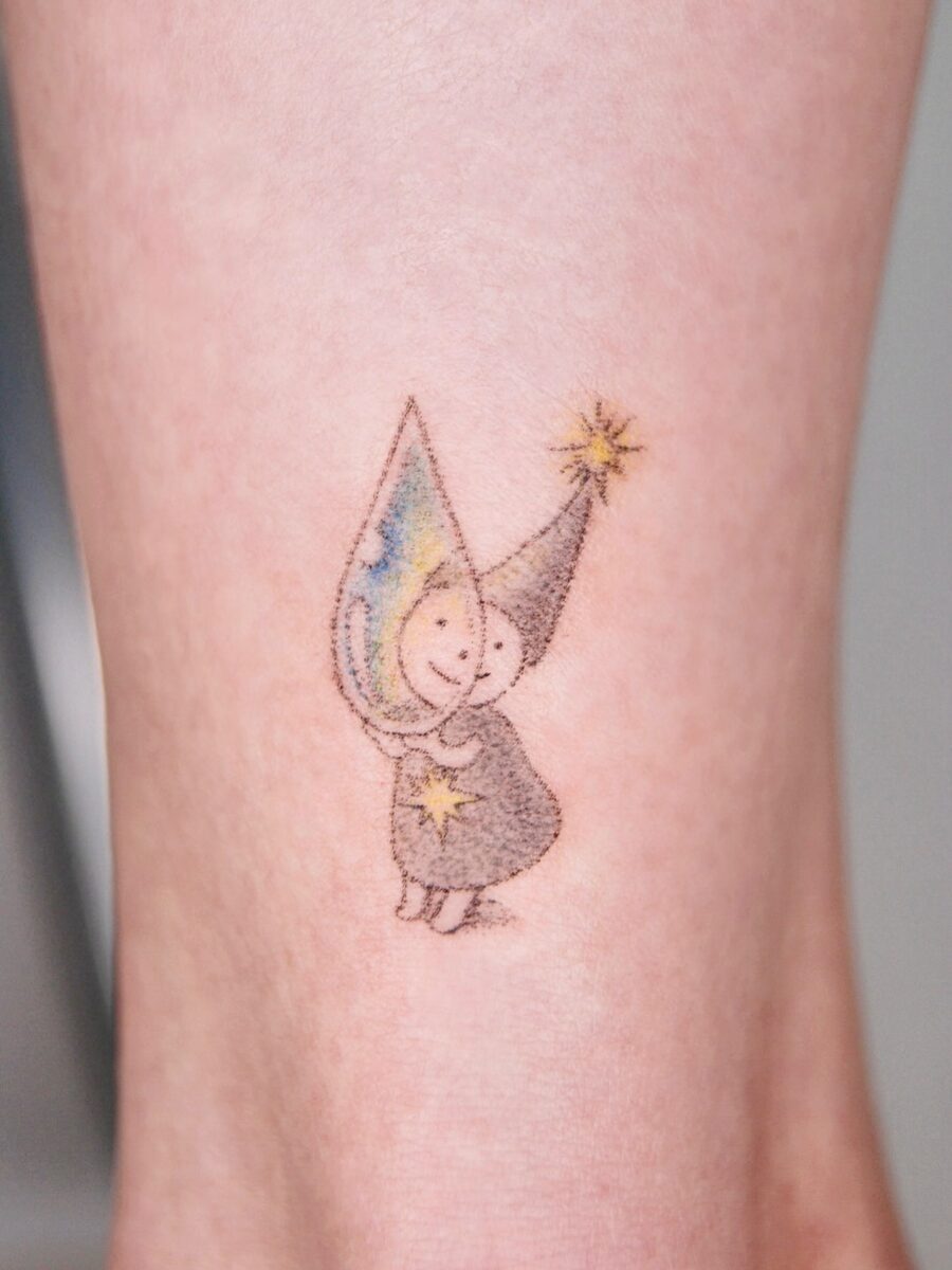 Charming fairy tattoo with playful colors Tattoo on skin