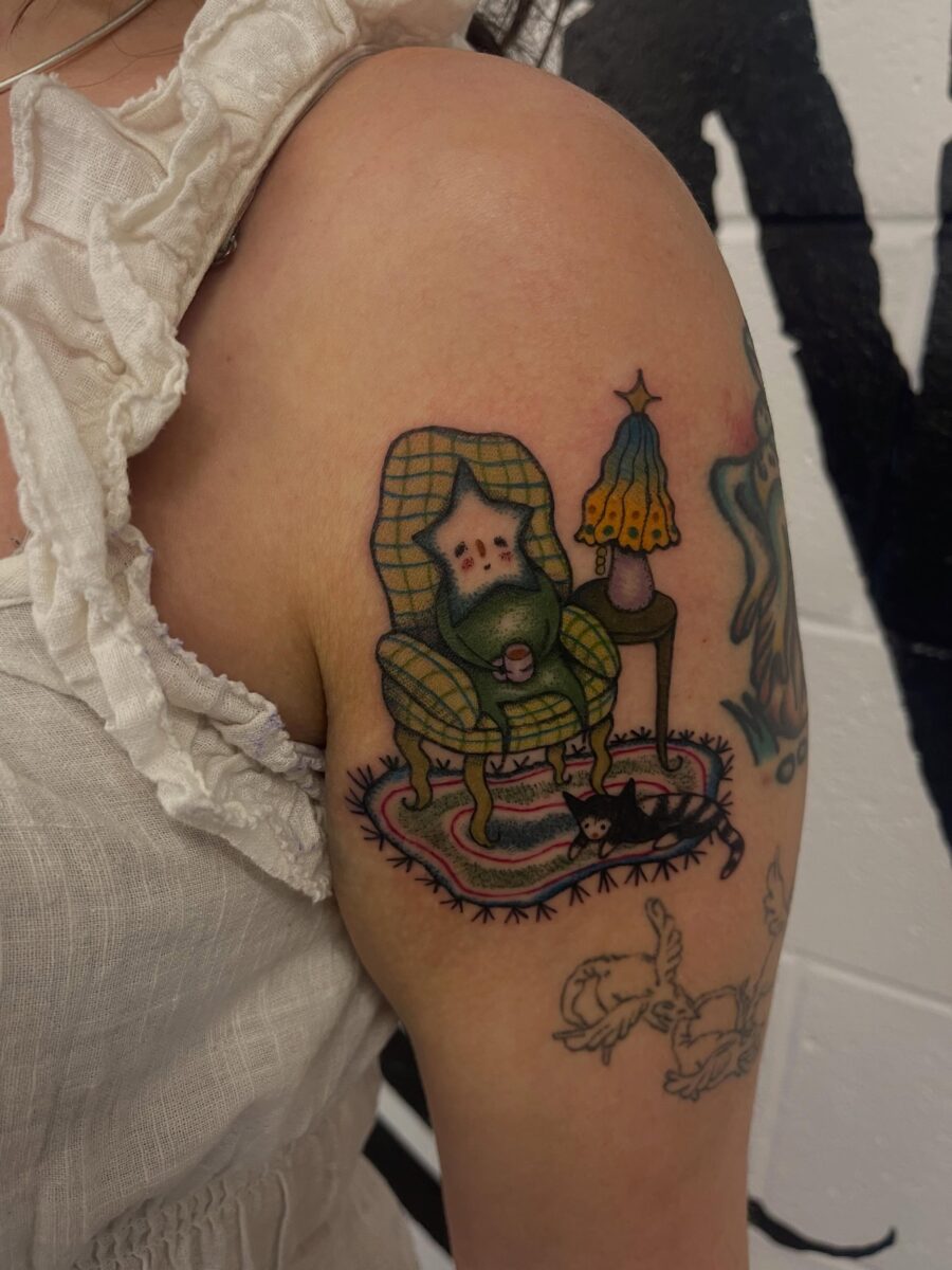 Charming gnome in a cozy chair tattoo Tattoo on skin