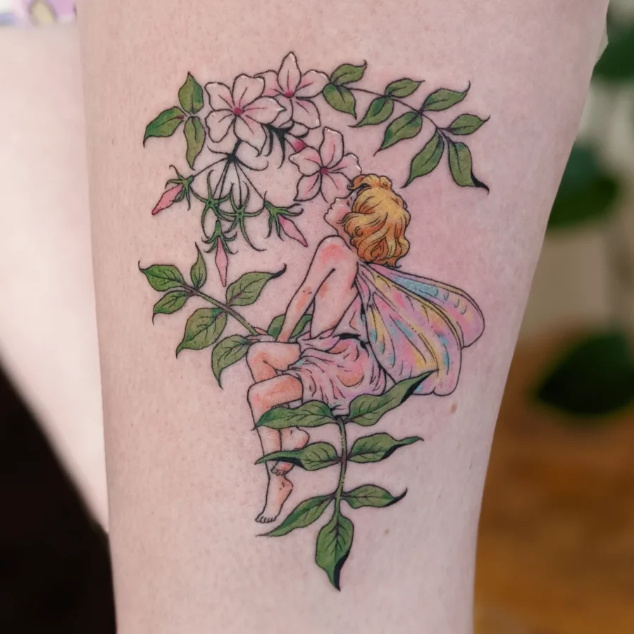 Enchanting fairy tattoo amidst blooming flowers Tattoo on skin